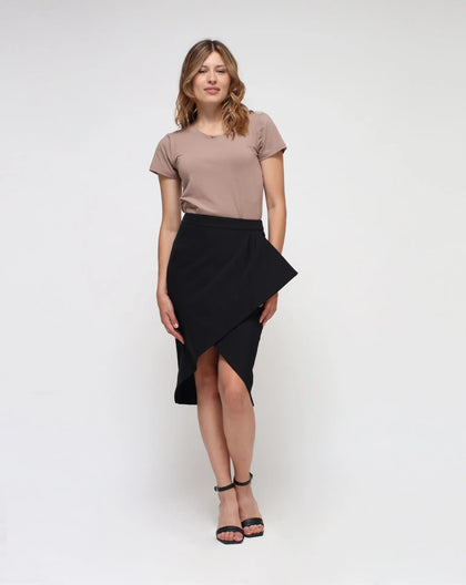 Woman wearing a black pencil skirt in white background.