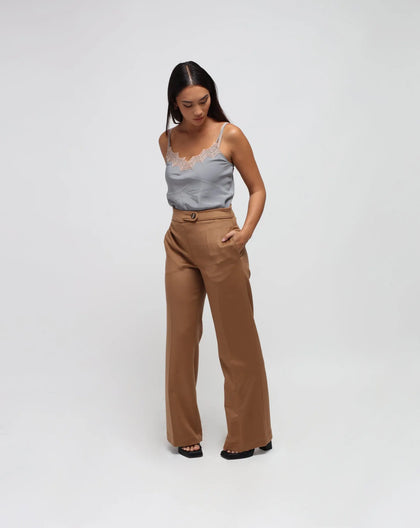 A model wearing beige straight cut zibeline wool camel pants.