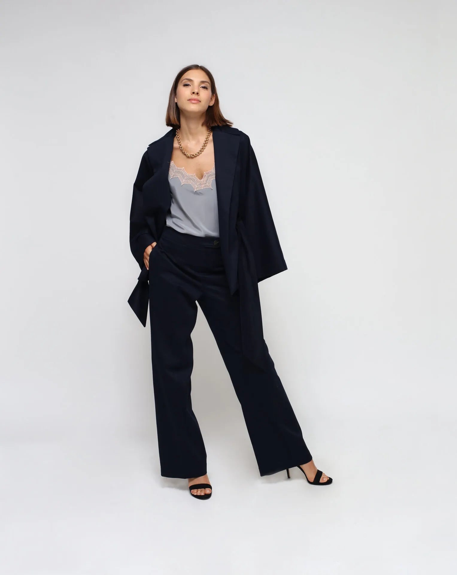 Woman wearing a blue outfit with a white background