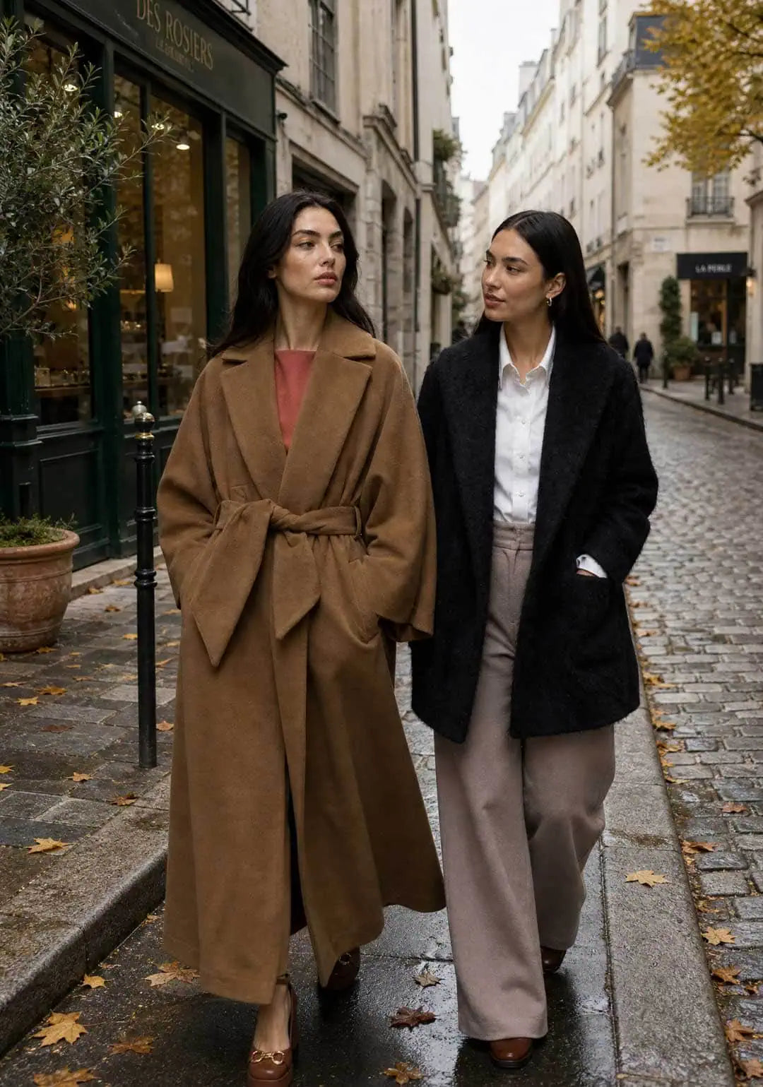 How to Choose a Winter Coat That Lasts: Two women wearing Humans and Land camel kimono coat and black alpaca short coat walking in Les Marais in Paris.